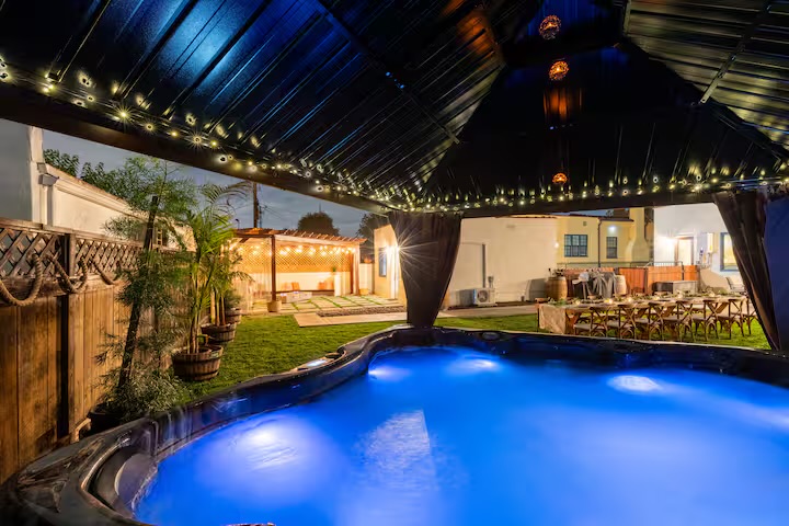 Saltwater jacuzzi at dusk in private backyard